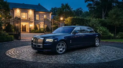 Rolls-Royce Ghost Extended limousine parked in front of a private estate gate